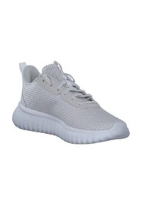 Ljusgrå sportskor med ett andningsbart mesh-överdel, rund tå och strukturerad vit sula. Har snörning och en dragflik vid hälen.