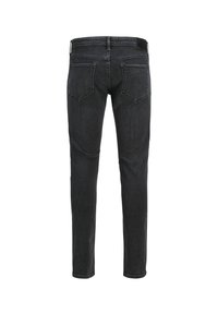 Jeans de mezclilla negra, corte slim, bolsillos traseros con detalle de costura, pierna recta y cintura estándar.