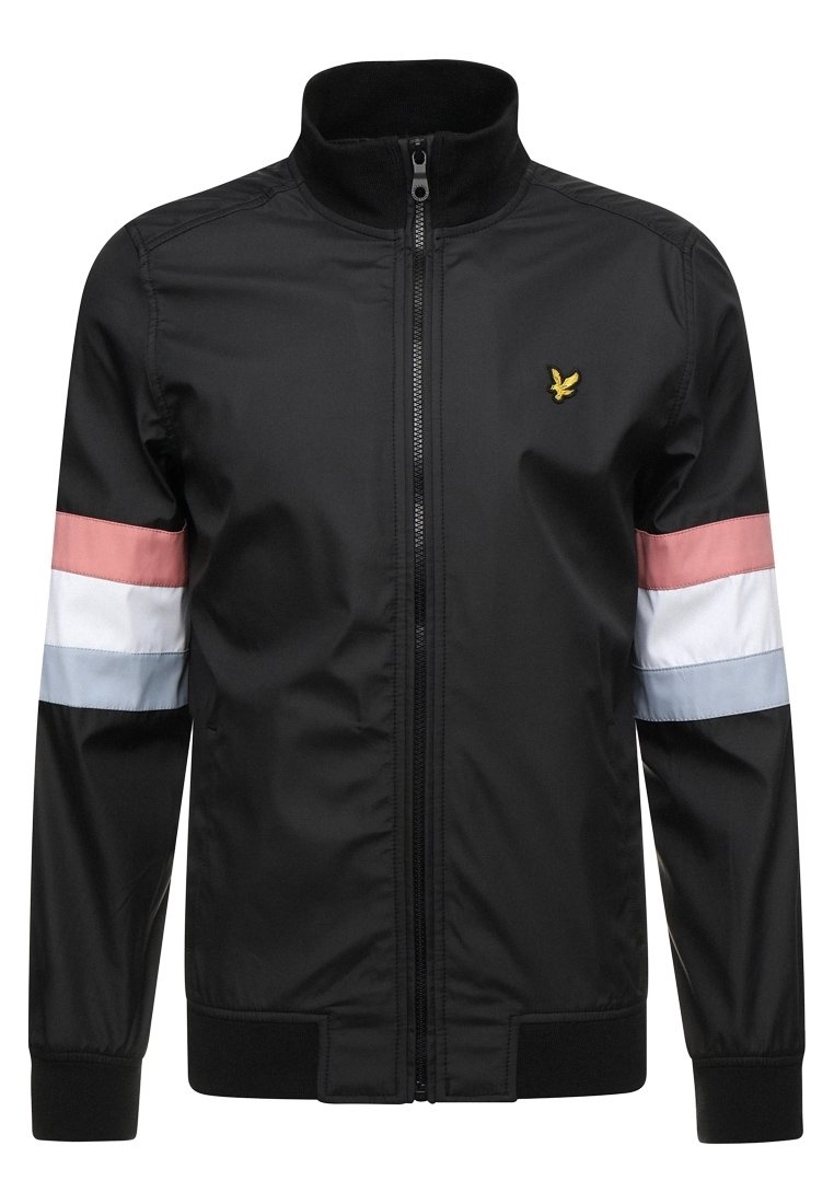 Schwarze Zip-Jacke mit rosa, weißen und hellblauen Streifen an den Ärmeln und einem kleinen gelben bestickten Vogel-Logo auf der Brust.