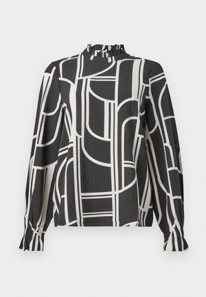 Blusa negra de manga larga con líneas geométricas abstractas en blanco, cuello alto con volantes y puños fruncidos en las mangas.
