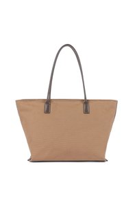 Sac fourre-tout en toile beige avec des poignées en cuir marron foncé, base rectangulaire et forme trapézoïdale large, présenté sur fond blanc.
