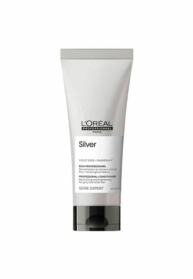 L'Oréal Professional conditioner in een witte tube van 200 ml met een zwarte pompdeksel, gelabeld "Silver," ontworpen om grijs en wit haar te neutraliseren.