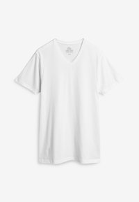 Tricou alb din bumbac, cu decolteu în V și mâneci scurte, având o croială lejeră și o textură moale, potrivit pentru ținute casual.