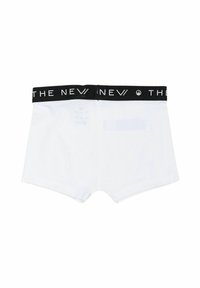 Boxers blancs avec un bandeau élastique noir portant le texte "THE NEW." Tissu lisse avec un design classique et sans motifs visibles.