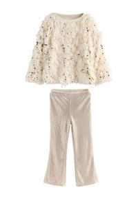 Two-piece children's outfit featuring a cream fringed top adorned with sequins and matching flared pants with a textured metallic finish.