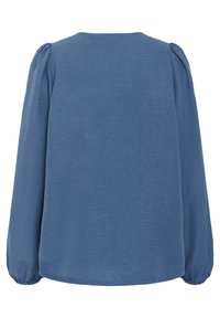 Blaue Bluse mit langen Ärmeln aus texturiertem Stoff, rundem Halsausschnitt und gerafften Details an den Bündchen und Schultern. Schlichte, gerade Schnittführung.
