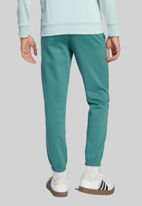 SLOGAN - Tracksuit bottoms - preloved teal2