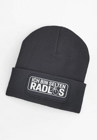 Black knit beanie featuring a sewn patch with white text: "ICH BIN SELTEN RADLOS" and a bicycle icon. Textured fabric with a snug fit.