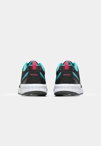 Black athletic shoes with turquoise accents and pink branding. Mesh upper, padded collar, and white sole with textured tread.