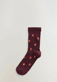 Burgundy ribbed socks featuring a repeating pattern of small red and yellow mushrooms. Made from soft, textured fabric.
