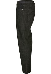 Schlank geschnittene schwarze Denim-Jeans mit schrägen Seitentaschen, dezenten Nähten und einer einzelnen Gesäßtasche. Glatte Textur mit klassischem Design.