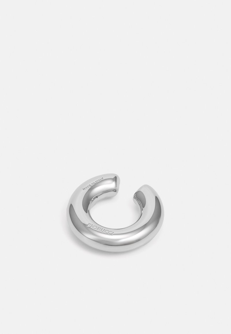 Silver metallic ring with a smooth, glossy finish. Features a slight cutout and embossed brand name. Round shape with a thick appearance.