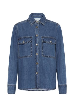 Tumed sinelshirt, millel on terav krae, esipaneelil nööbid ja kaks rinna taskut nööpklappidega. Iseloomulikud õmblusdetailid.