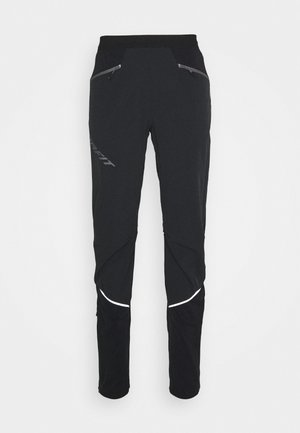 Pantalons de sport noirs en matériau flexible, avec des poches zippées, des accents réfléchissants et un design fuselé.