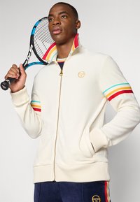 Sergio Tacchini SLICE TRACK JACKET - Veste de survêtement - gardenia/gold