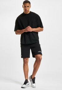 DEF SHOP X EUROPEAN LEAGUE OF FOOTBALL MUNICH RAVENS - Joggebukse - black