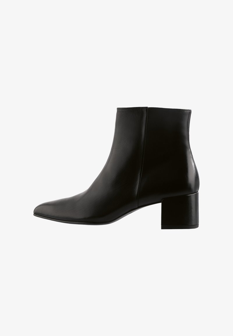 Black leather ankle boot with a pointed toe and block heel. Smooth texture, minimal design, and a solid color without visible hardware.