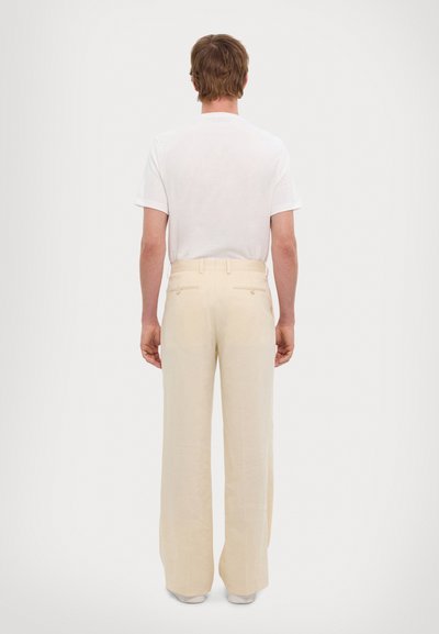 Cream-colored, wide-leg trousers made of lightweight fabric, featuring a tailored fit, two back pockets, and a smooth texture.
