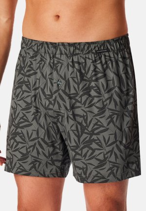 Shorts da nuoto da uomo in tessuto grigio scuro con un motivo a foglia nera, dotati di una vita elastica e chiusura frontale con bottone.
