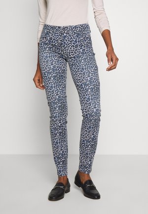 Jean skinny imprimé léopard en bleu et gris, avec une taille mi-haute, cinq poches et un tissu lisse, légèrement extensible.