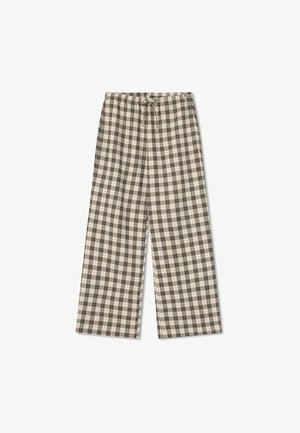 Rutig vida byxor i beige, bruna och krämiga nyanser. Har resårmidja med dragsko och mjuk tygtextur.