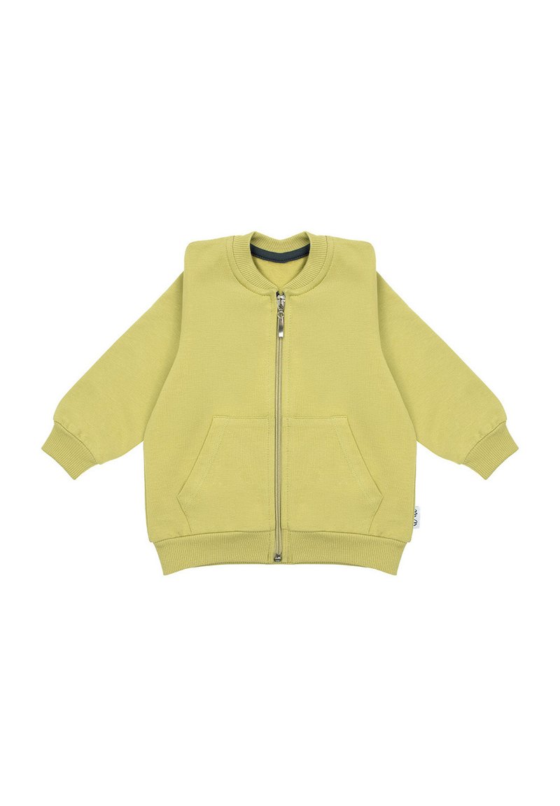 Żółta bluza z kapturem na zamek błyskawiczny z przodu, z ściągaczami na rękawach i dwoma przednimi kieszeniami. Wykonana z miękkiego materiału o luźnym kroju.