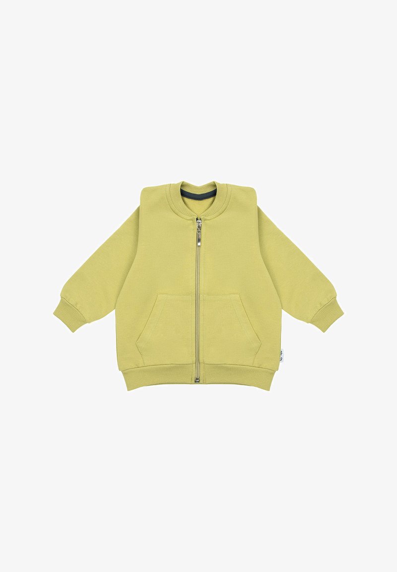 Żółta bluza z kapturem na zamek błyskawiczny z przodu, z ściągaczami na rękawach i dwoma przednimi kieszeniami. Wykonana z miękkiego materiału o luźnym kroju.