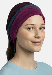 Multicolored headwrap made of soft fabric, featuring layers in dark purple, light purple, and blue. Smooth texture, snug fit.