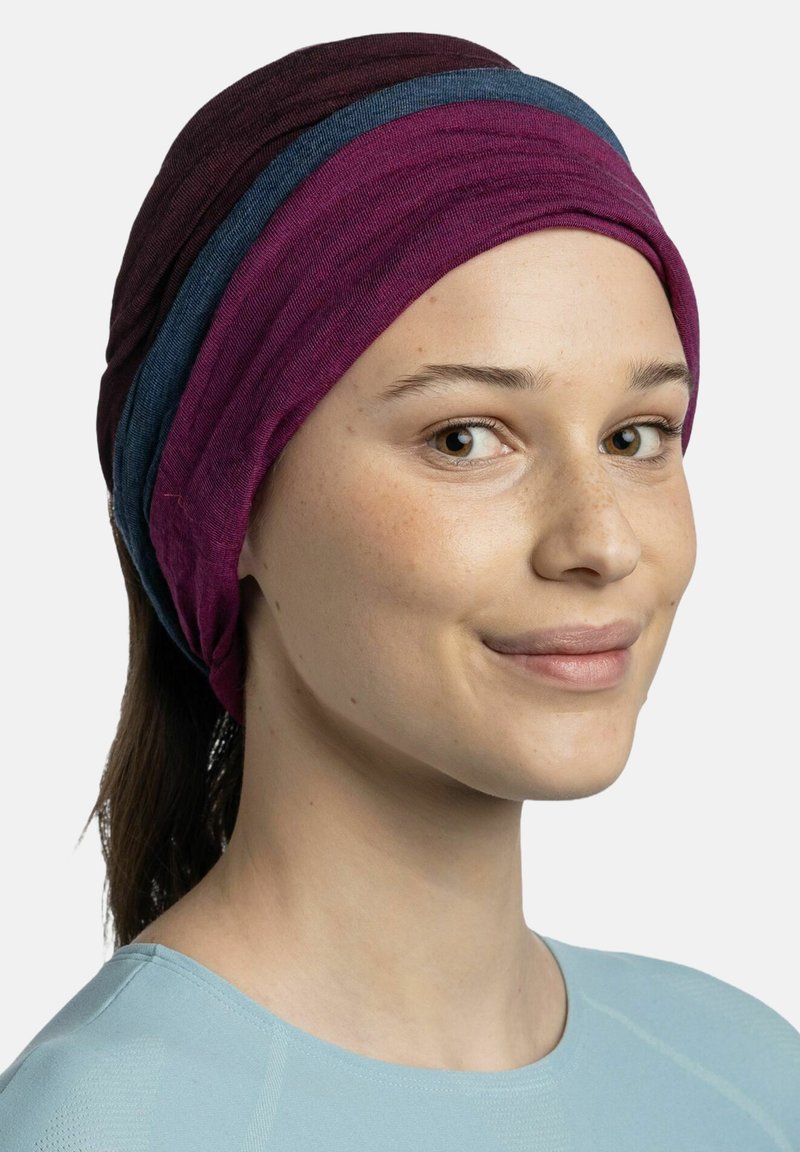 Multicolored headwrap made of soft fabric, featuring layers in dark purple, light purple, and blue. Smooth texture, snug fit.