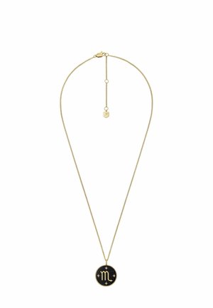 Collier en ton or avec une fine chaîne et un pendentif rond arborant un fond noir, un symbole du zodiaque et des motifs d'étoiles. Longueur ajustable.