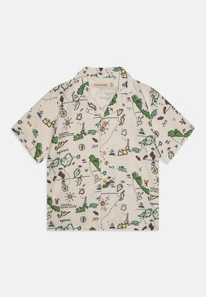 Kortermet skjorte i lys beige stoff med et fargerikt kartmønster med grønne, brune, blå og gule detaljer, og knappestolpe foran.