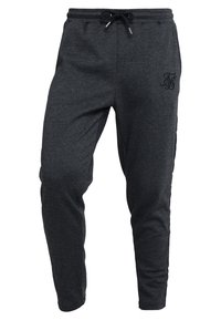 Mörkgrå tapered sweatpants med elastisk midja, svart dragsko, subtilt herringbone-mönster och broderad logo på höger lår.