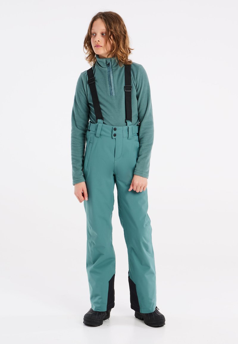 Pantalons de ski teal avec bretelles noires réglables, taille haute et coupe élégante. Comprend des poches zippées et des panneaux de cheville noirs renforcés.