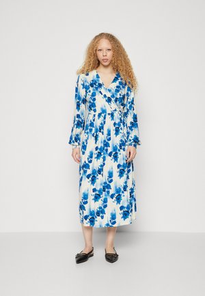 Floral wrap dress with long sleeves, featuring blue flower patterns on a white background. Below-knee length, smooth fabric with a tie waist.