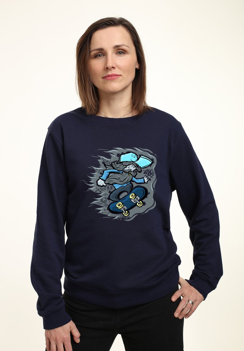 Felpa blu navy con grafica di un personaggio dei cartoni animati che fa skateboard, in colori vivaci, con texture dettagliate sul tessuto.