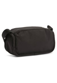 Czarna prostokątna kosmetyczka wykonana z gładkiego nylonu, z zamkiem błyskawicznym i boczną rączką do łatwego noszenia. Teksturowana powierzchnia.