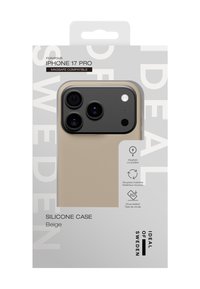 Custodia in silicone beige per iPhone 17 Pro, compatibile con MagSafe. Presenta una consistenza liscia, bordi arrotondati e un design elegante con stampa del logo.