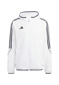 Chaqueta deportiva blanca con cremallera frontal, capucha y franjas negras en las mangas. Presenta un logo de Adidas en la parte superior izquierda. Textura suave.