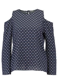 Navy blue blouse with open shoulder design, featuring a repetitive pink triangular pattern, long sleeves, and a keyhole back closure.