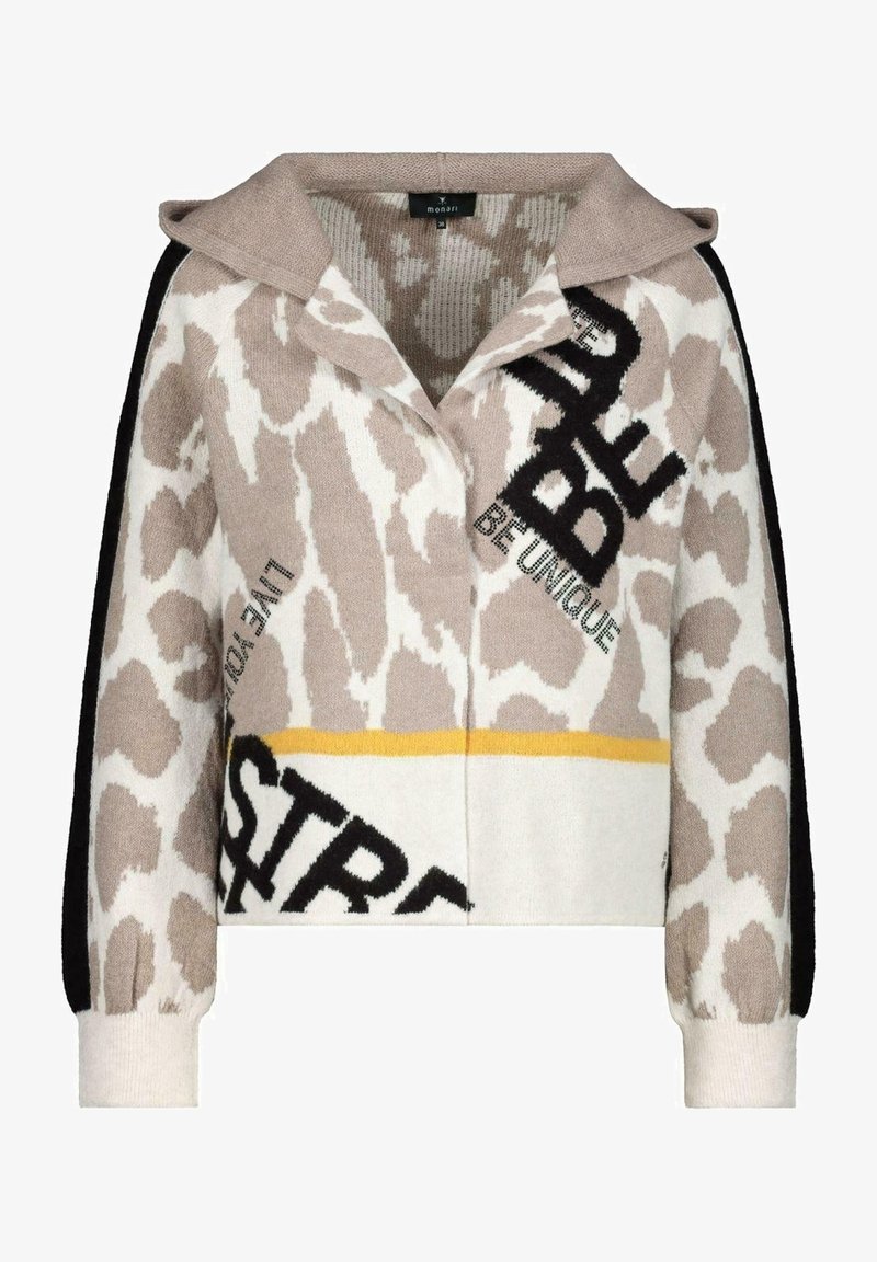 Pull en tricot avec un imprimé animal beige et blanc, présentant des accents noirs, un col et des graphiques textuels dans des couleurs contrastées.