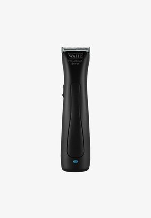 Battery-operated trimmer with a black plastic body, featuring a stainless steel blade, ergonomic shape, and a power indicator light.