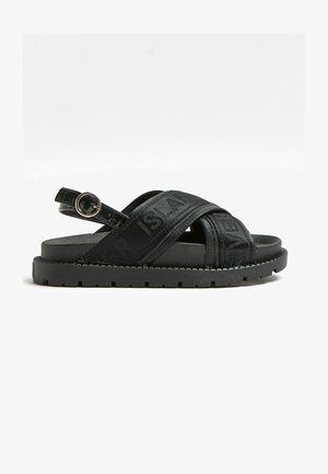 BRANDED CROSS OVER - Platform sandals - black