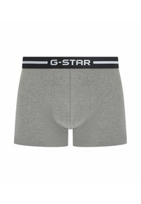 Boxers en coton gris avec une ceinture noire portant le logo G-Star, texture lisse et conception de poche moulante.