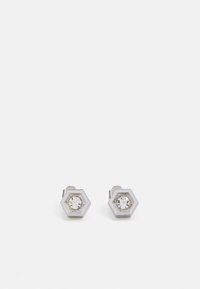 Pendientes de tuerca hexagonales en plata con un cristal claro central. Presentan una superficie pulida y una marca grabada en el lateral.