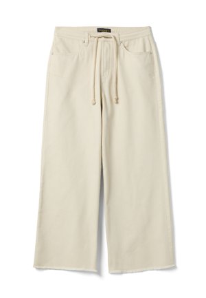 Pantalones beige de pierna ancha con cintura ajustable con cordón, bolsillos delanteros, trabillas para cinturón y dobladillo sin terminar.