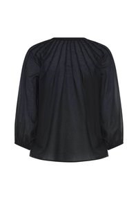 Blouse noire à manches longues avec un yoke froncé dans le dos et des poignets élastiqués, réalisée en tissu léger et semi-transparent.