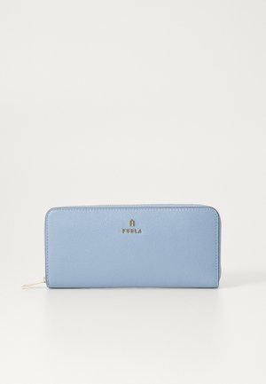 Light blue leather wallet with a textured finish, featuring a gold logo at the center and a zip closure on one side.