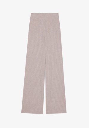 Wide-leg pants in light beige, ribbed texture, elastic waistband, flowing shape. Fabric appears soft and breathable. No visible hardware or accents.