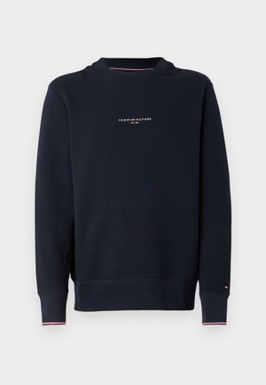 Marineblauwe sweatshirt met een ronde hals, voorzien van een kleine witte logo-tekst op de borst, geribbelde manchetten en contrasterende rode en witte accenten.