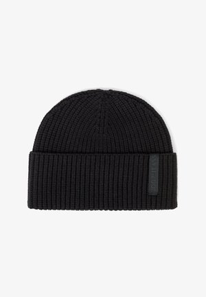 Black ribbed knit beanie hat with folded cuff and small rectangular label on the side.